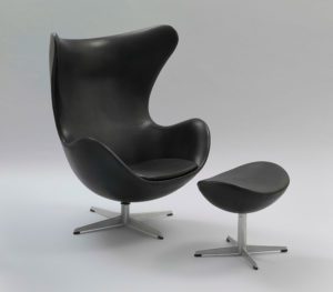 'Egg' armchair and stool, 1958. Chromed steel, aluminum, seat in polyurethane foam reinforced with fiberglass and covered in leather.