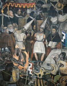 The history of the inquisition murales by Diego Rivera. One sees soldiers, members of the church, and people put at the stake to burn.
