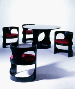 A 'Prepop' dining suite. 1969. ebonised birch plywood, red fabric.