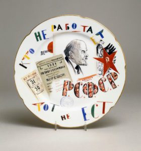 A Soviet propaganda plate, painted with the profile of Lenin and the slogan 'He who does not work does not eat'. 1922. after Mikhail Adamovich