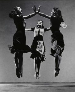 Three dancers in a Martha Graham’s choreography jumping in air. Museum of Modern Art (MoMA), New York, USA