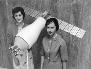 NASA scientists with a model of a Pegasus satellite, 1964.