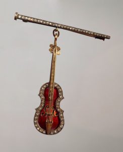 Goldsmith's art, France, 19th century. Precious stones, enamel and gold brooch shaped as a violin.