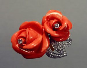 Rose-shaped coral and diamond set brooch by Cartier 1972