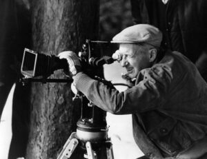French film director Claude Autant-Lara during filming, 1973