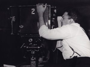 Federico Fellini filming with a camera