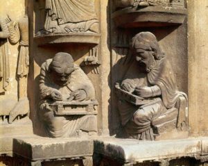 detail of scultures of Aristotle and Pythagoras from the tympanum of door in chartres cathedral