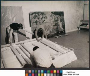 Registrar staff members unpacking artworks for the exhibition 'Italian Masters' (against the wall is Sandro Botticelli's 'Birth of Venus'), MoMA, NY, January 26 through April 7, 1940 - 0132130