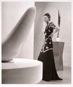 elegantly dressed female model with Brancusi sculpture photo black and white by Dahl-wolfe