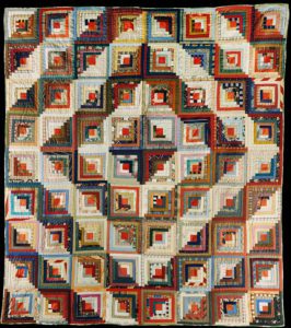 American School, (19th/20th century). An Amish pieced & quilted cotton coverlet worked in a variation of the log cabin pattern. Holmes County, Ohio. Late 19th / early 20th century.. cotton